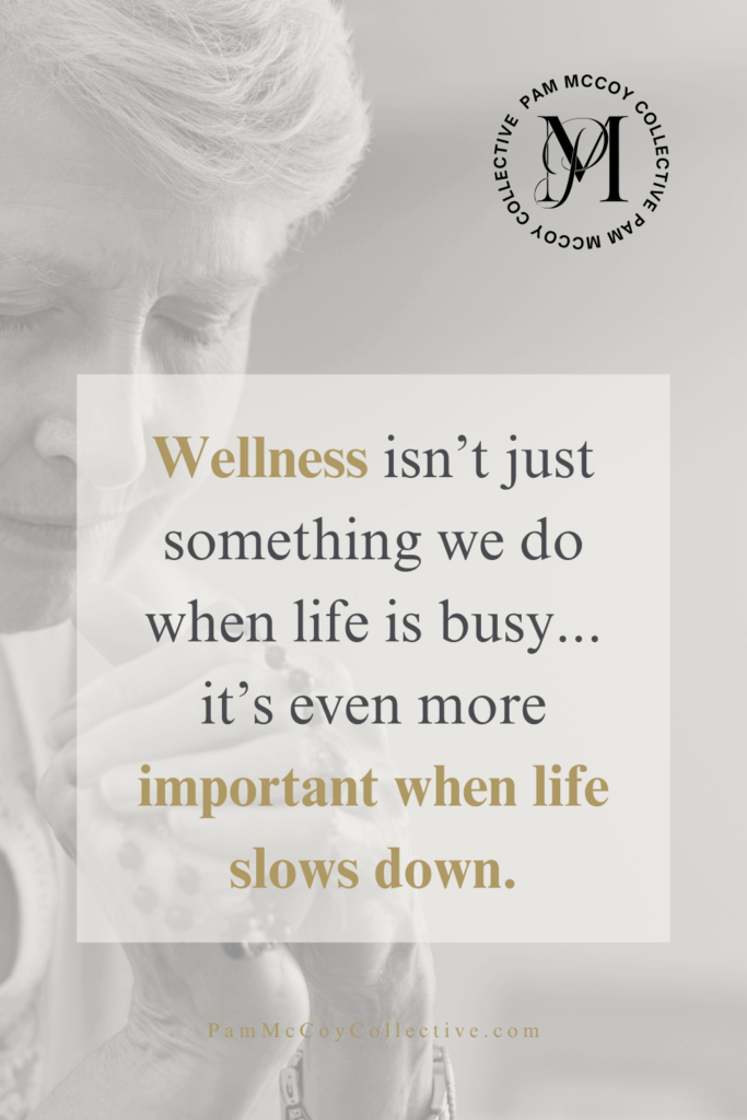 Midlife woman praying with eyes closed, symbolizing calm, mindfulness, and prioritizing wellness during slower seasons of life. Words say: Wellness isn't just something we do when life is busy....it's even more important when life slows down.